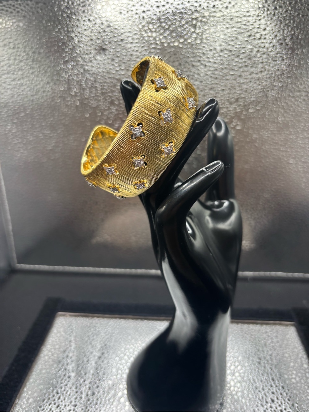 Gold-Tone Textured Cuff Bracelet with Crystal Fleur Accents